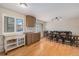 Dining room with hardwood floors, light fixture, and large table with seating, creates a bright, welcoming space at 7777 Newman St, Arvada, CO 80005