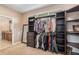 Organized walk-in closet with custom shelving and plenty of room for storage, provides a practical space at 7777 Newman St, Arvada, CO 80005