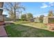 Lush backyard with shed and mature trees at 3901 Newland St, Wheat Ridge, CO 80033