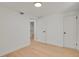 Finished basement space with light-colored flooring, white trim, and doors at 3901 Newland St, Wheat Ridge, CO 80033