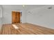 Bedroom with hardwood floors, closet, and neutral paint at 3901 Newland St, Wheat Ridge, CO 80033