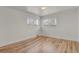 Bright bedroom with hardwood floors and two large windows at 3901 Newland St, Wheat Ridge, CO 80033