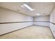 Unfinished basement space with wood trim and paneled walls. Includes ceiling tile at 2556 S Eagle Cir, Aurora, CO 80014