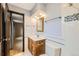 Recently renovated bathroom with a blue wall and custom vanity at 2556 S Eagle Cir, Aurora, CO 80014