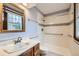 Bathroom features a walk-in shower with grab bars and a marble-topped vanity at 2556 S Eagle Cir, Aurora, CO 80014