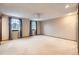 Bright bedroom with neutral carpet, large windows, and a ceiling fan at 2556 S Eagle Cir, Aurora, CO 80014