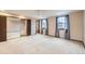 Bedroom with neutral carpet, closet and a window with natural light at 2556 S Eagle Cir, Aurora, CO 80014