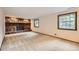 Spacious living room with a stone fireplace and large windows for natural light at 2556 S Eagle Cir, Aurora, CO 80014