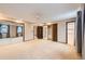 Spacious primary bedroom with mirrored closet doors and an ensuite bathroom at 2556 S Eagle Cir, Aurora, CO 80014
