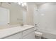 Bright bathroom featuring white cabinets, a modern countertop, and a shower over tub at 457 Interlocken Blvd # 103, Broomfield, CO 80021