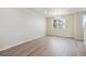 Bright dining room with wood flooring, chandelier, and large window at 457 Interlocken Blvd # 103, Broomfield, CO 80021