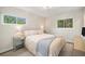 Cozy bedroom with natural light, mirrored nightstands, and a comfortable bed with soft bedding at 8299 E Kenyon Ave, Denver, CO 80237