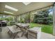Covered outdoor patio with a large table, benches and a storage box at 8299 E Kenyon Ave, Denver, CO 80237