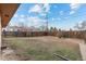 Spacious backyard featuring a wooden fence and an expansive grass area at 8661 W 32Nd Pl, Wheat Ridge, CO 80033
