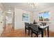 Elegant dining area with a modern table and chairs, and ample natural light at 8661 W 32Nd Pl, Wheat Ridge, CO 80033