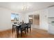 Chic dining room with modern lighting and a sliding glass door to the outdoors at 8661 W 32Nd Pl, Wheat Ridge, CO 80033