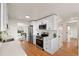 Contemporary kitchen with white cabinets, quartz countertops, and stainless steel appliances at 8661 W 32Nd Pl, Wheat Ridge, CO 80033