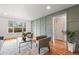 Bright living room with hardwood floors, modern furniture, and views of the outdoors at 8661 W 32Nd Pl, Wheat Ridge, CO 80033