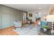 Inviting living room featuring a modern sofa, stylish decor, and hardwood floors at 8661 W 32Nd Pl, Wheat Ridge, CO 80033
