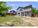 Backyard with a patio and ample outdoor space, partially enclosed by a wood fence at 4422 E Andover Ave, Castle Rock, CO 80104