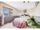 Bedroom featuring a large window offering plenty of natural light and a stylish, patterned bed at 4422 E Andover Ave, Castle Rock, CO 80104
