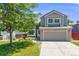 Charming two-story home featuring a well-maintained lawn and an attached two-car garage at 4422 E Andover Ave, Castle Rock, CO 80104