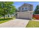Well maintained two-story home featuring a spacious driveway and an attached two-car garage at 4422 E Andover Ave, Castle Rock, CO 80104