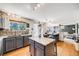 Spacious kitchen features stainless appliances, granite counters and hardwood floors at 4422 E Andover Ave, Castle Rock, CO 80104