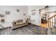 Comfortable living room featuring hardwood floors and staircase at 4422 E Andover Ave, Castle Rock, CO 80104