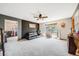 Spacious living room with a large window, a black accent wall, and neutral-toned carpet at 4422 E Andover Ave, Castle Rock, CO 80104