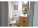 Bright bathroom features a tile shower, modern vanity and updated fixtures at 5541 Umatilla St, Denver, CO 80221