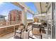 Relaxing outdoor balcony featuring an outdoor grill, seating, and views at 1610 Little Raven St # Ph6, Denver, CO 80202