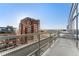 Balcony overlooking the city with distant mountain views on a sunny day at 1610 Little Raven St # Ph6, Denver, CO 80202