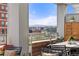 Outdoor patio featuring comfortable seating, plants, and expansive neighborhood views at 1610 Little Raven St # Ph6, Denver, CO 80202