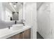 Modern bathroom with stylish vanity, white countertop, mosaic tile, and rainfall shower at 1610 Little Raven St # Ph6, Denver, CO 80202
