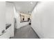 Well-organized laundry room with modern washer, dryer, storage, and countertop space at 1610 Little Raven St # Ph6, Denver, CO 80202