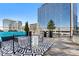 Relax on this rooftop deck with its contemporary outdoor furniture and skyline views at 1610 Little Raven St # Ph6, Denver, CO 80202