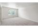 Spacious bedroom with carpet flooring and a window at 4743 Hatcher Dr, Brighton, CO 80601