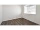 Neutral room with a window and luxury vinyl plank flooring at 4743 Hatcher Dr, Brighton, CO 80601