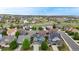 Community aerial view showcasing multiple homes, landscape, and beautiful neighborhood with rolling hills in the background at 3717 Desert Ridge Cir, Castle Rock, CO 80108