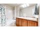 Bathroom featuring double sinks and a shower/tub combo at 3717 Desert Ridge Cir, Castle Rock, CO 80108