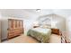 Comfortable bedroom with ample natural light, featuring a decorative dresser and neutral walls at 3717 Desert Ridge Cir, Castle Rock, CO 80108