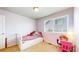 Bright bedroom with a cozy bed, a window with blinds, and a study desk at 3717 Desert Ridge Cir, Castle Rock, CO 80108