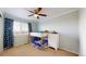 Bedroom with bunk beds, a ceiling fan, a window with blinds, and a dresser at 3717 Desert Ridge Cir, Castle Rock, CO 80108