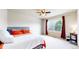 Bedroom featuring a ceiling fan, a window with curtains, and a cozy bed at 3717 Desert Ridge Cir, Castle Rock, CO 80108