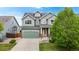 Charming two-story home boasts a well-manicured lawn, inviting curb appeal, and an attached two-car garage at 3717 Desert Ridge Cir, Castle Rock, CO 80108
