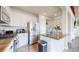 Bright kitchen features white cabinets, stainless steel appliances, and a stylish island with a sink at 3717 Desert Ridge Cir, Castle Rock, CO 80108