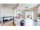 Bright, eat-in kitchen featuring hardwood floors, stainless steel appliances, and a sliding glass door with a balcony at 3717 Desert Ridge Cir, Castle Rock, CO 80108