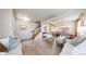 Inviting living room featuring hardwood floors, a staircase, and an open layout leading to the dining area at 3717 Desert Ridge Cir, Castle Rock, CO 80108