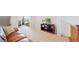 Comfortable loft area with a plush leather sofa and a view of the study at 3717 Desert Ridge Cir, Castle Rock, CO 80108